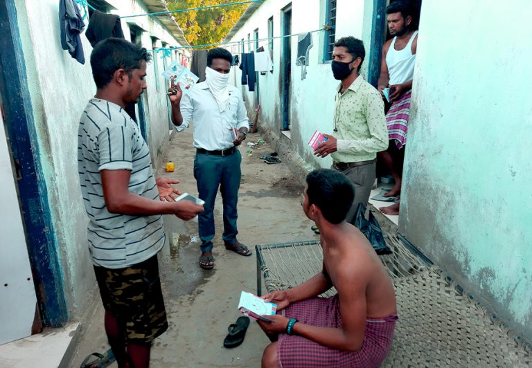 Distributing Booklets To VIllagers