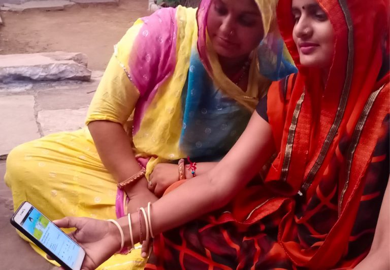 Women Watching A Training Video On A Mobile